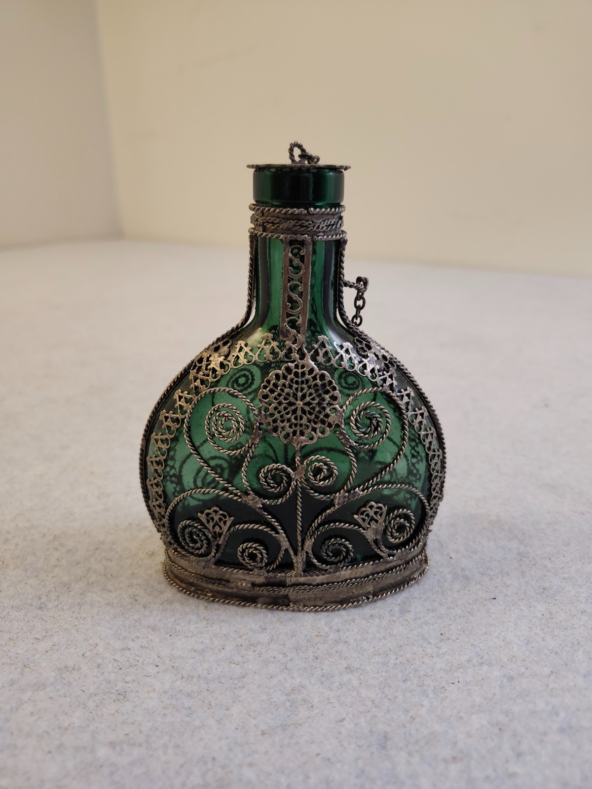 Vintage Emerald green glass silvered copper wire filligree bottle