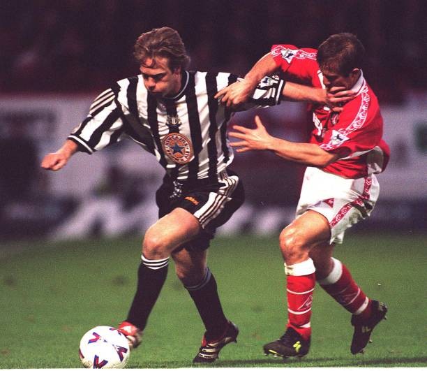 Newcastle United\'s Warren Barton fights off a challenge from Charl- Old Photo