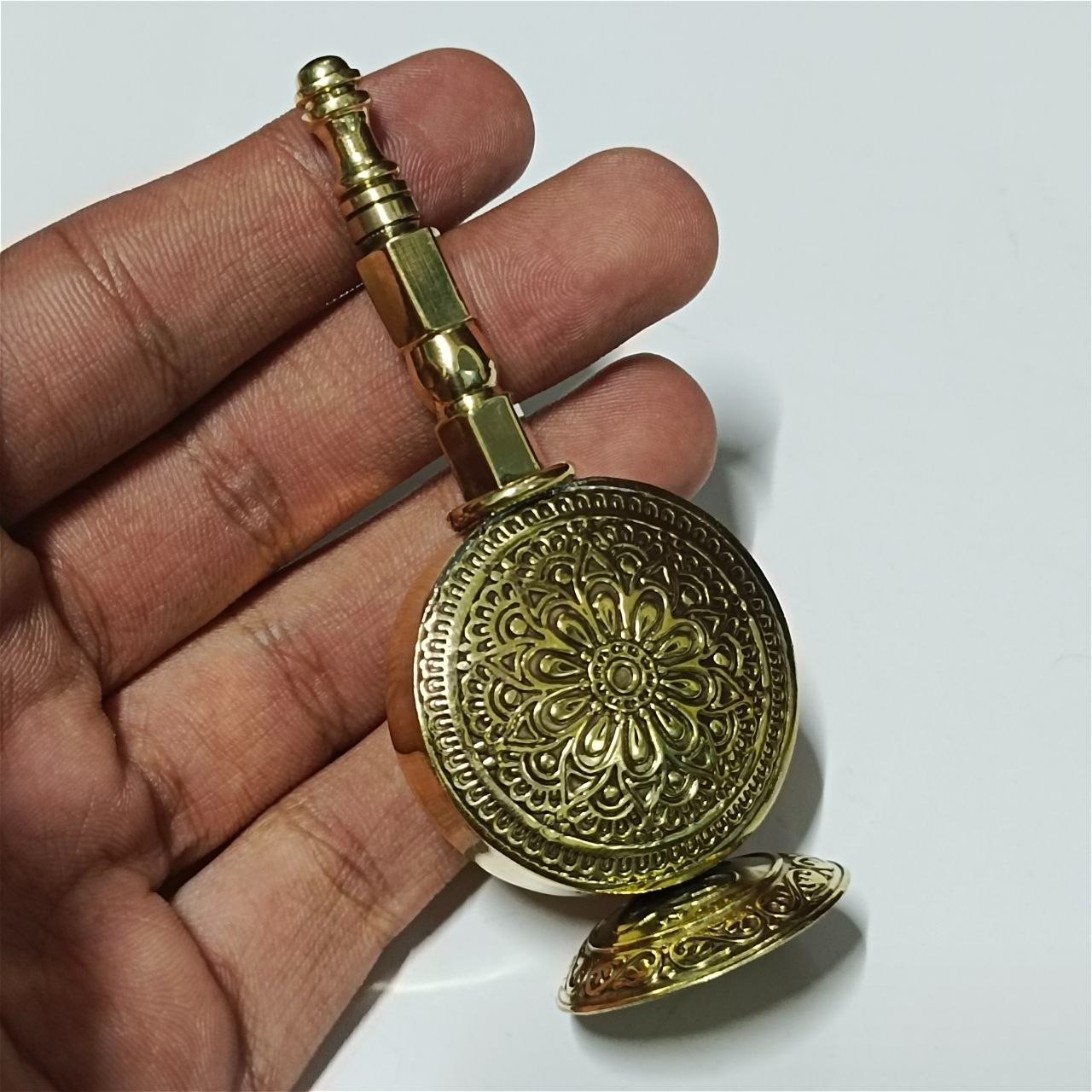 Handcrafted Egyptian brass kohl bottle with intricate Ottoman style engraving.