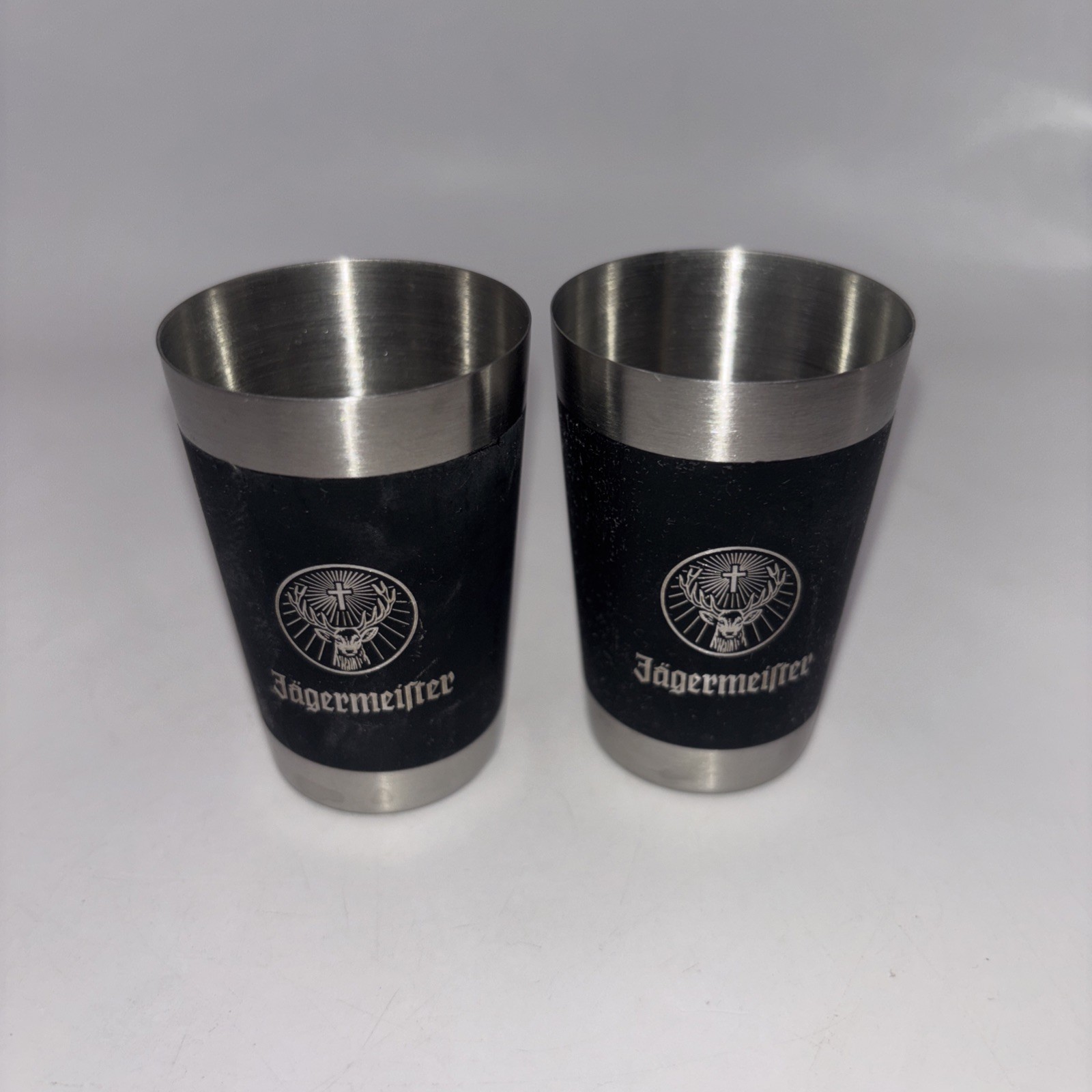 Jagermeister Shot Glasses Set of 2 Stainless Steel Black Silver Logo 2.5 oz Jagermeister Shot Glasses Set of 2 Stainless Steel Black Silver Logo 2.5 oz