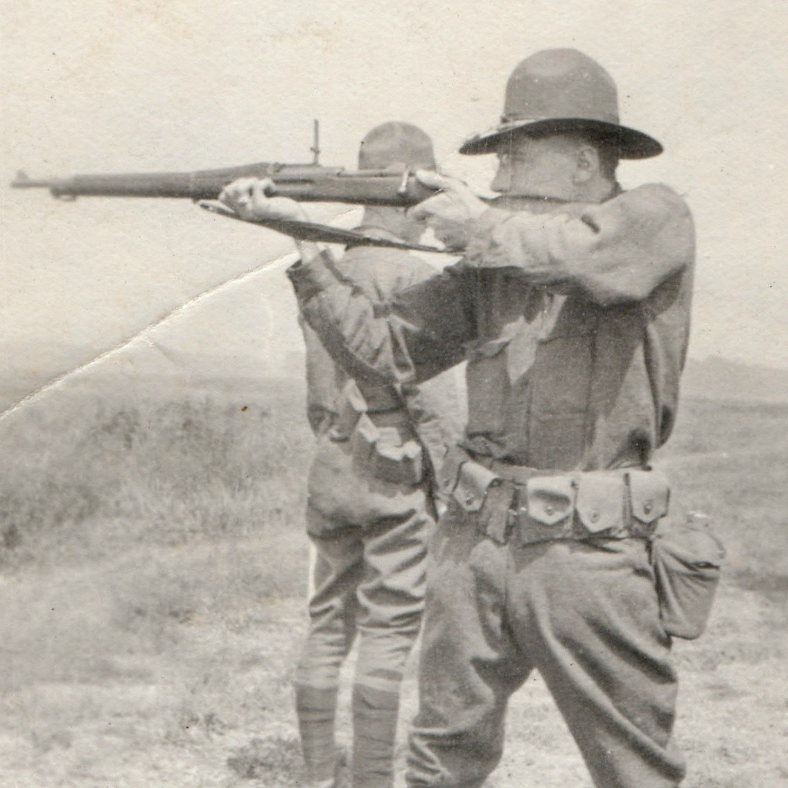 c1910s WWI US Army Soldier Aiming Rifle Campaign Hat Snapshot Photo Puttees Vtg