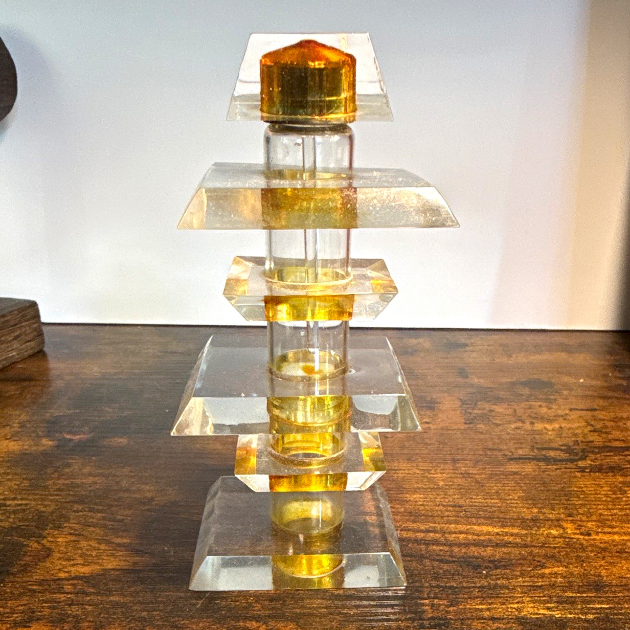 The image shows a vintage Art Deco-style stacked clear and amber Lucite/ perfume
