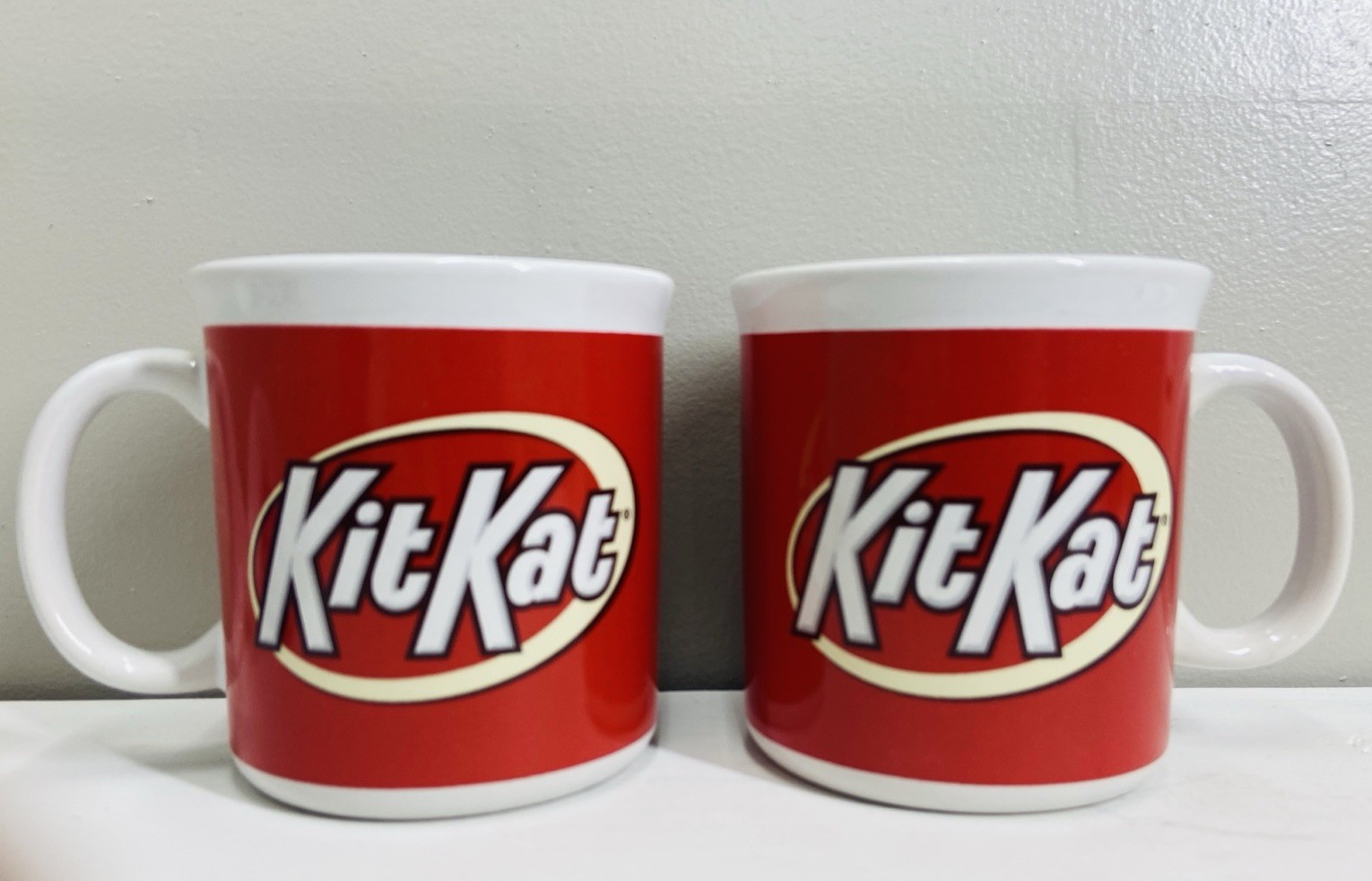 2 Kit Kat coffee mugs 12 - 14 oz. Excellent Condition