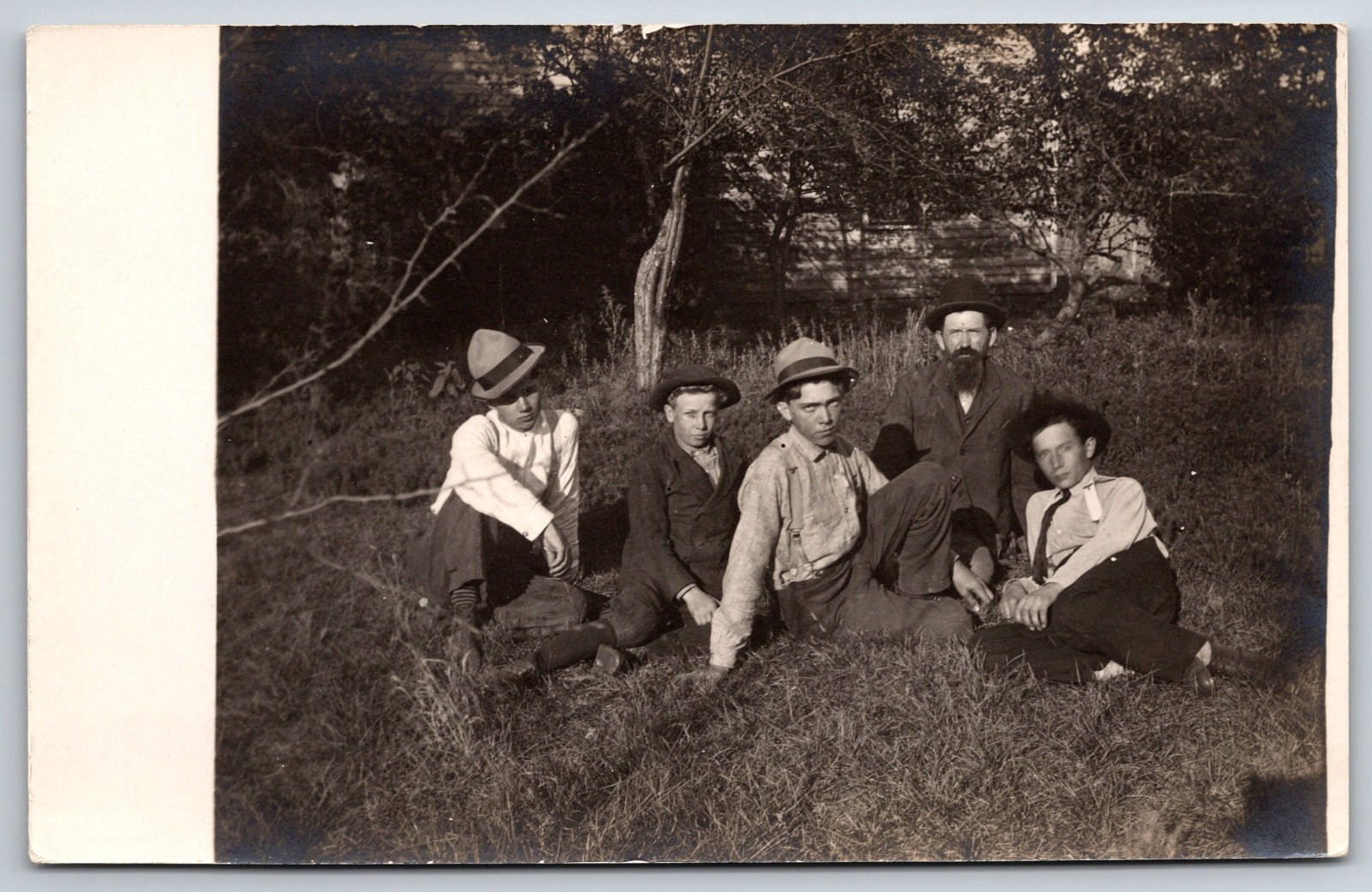 c 1910 RPPC Group Young Men or Man and Sons Family Hat Suspenders Ties Fashion