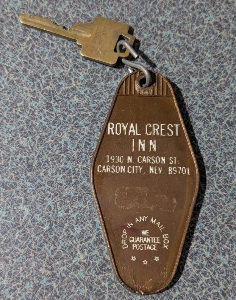 VTG Plastic Bronze-Tone Royal Crest Inn Postage Hotel Motel Key Chain Fob RARE