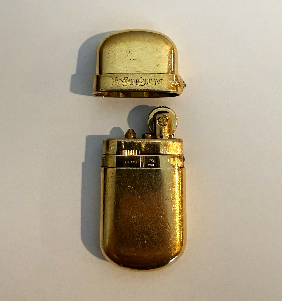 Yves Saint Laurent Gold Pocket Lighter w/ Portrait Detail, Gold-Tone Finish