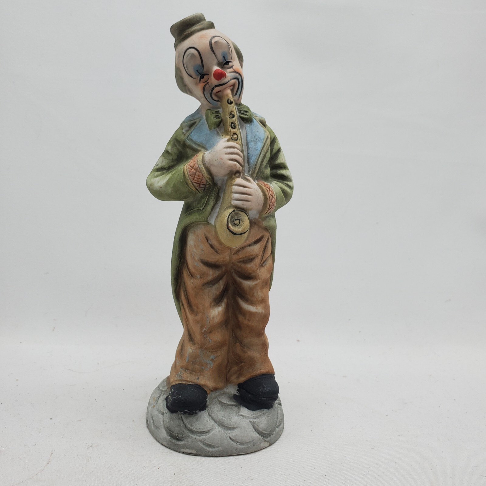 Hobo Clown Playing Saxophone  7 1/2” Ceramic Figurine .....