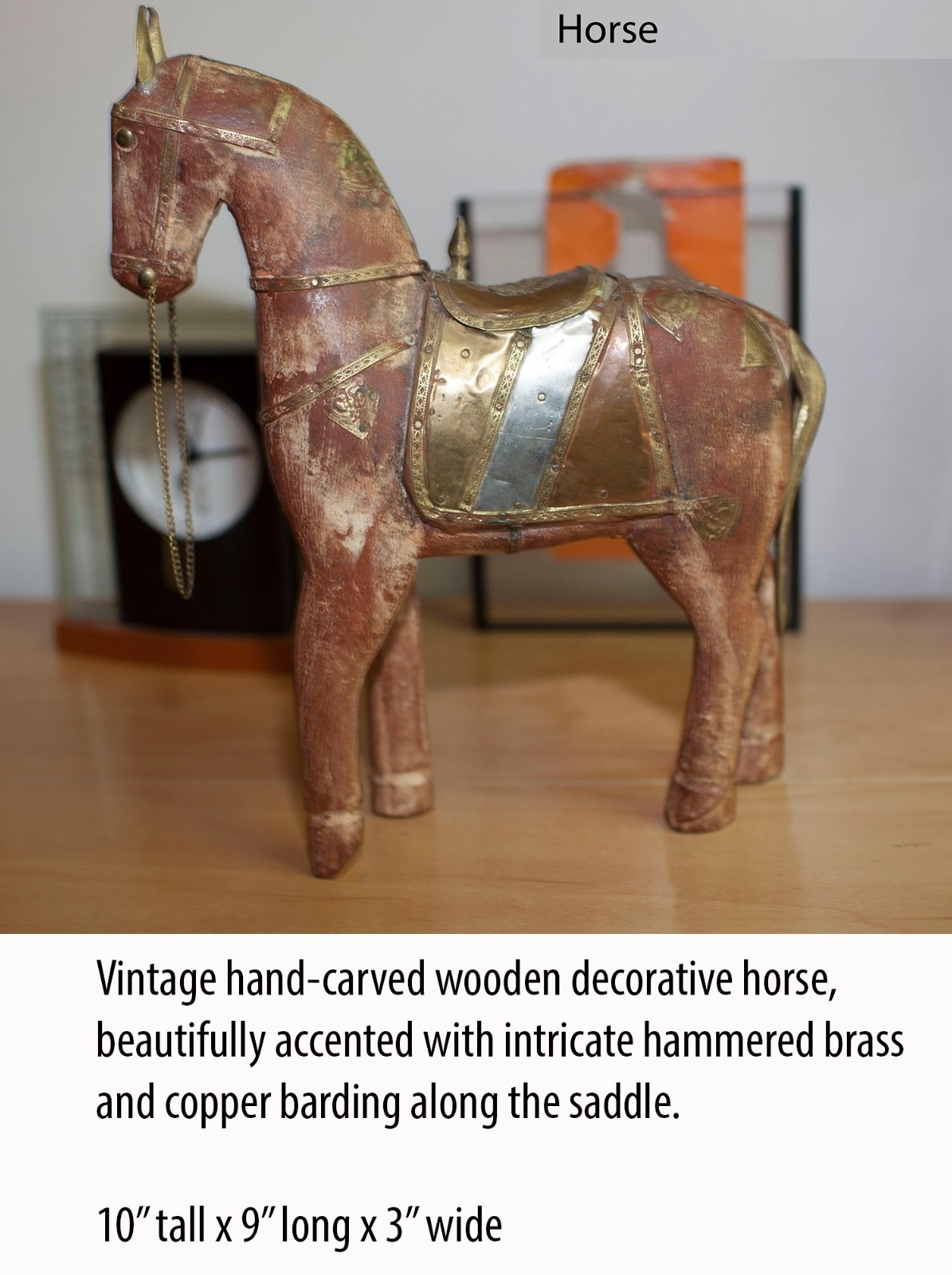 Vintage hand-carved wooden horse figurine, accented with brass and copper.