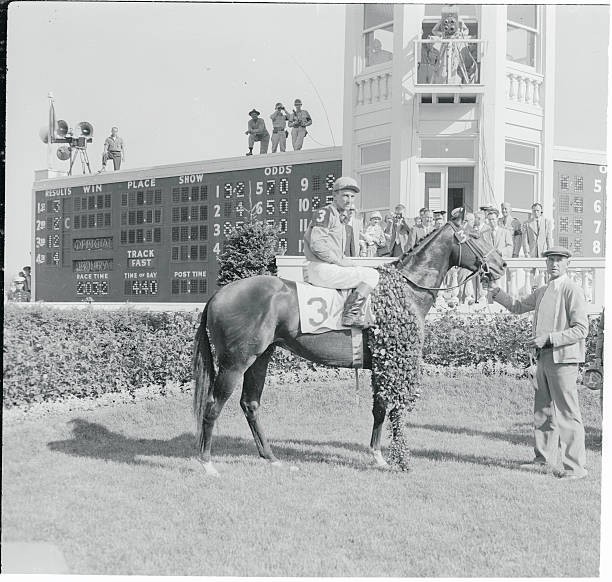 Jockey Dave Erb groom Joe Rutter share winners circle Needles aft- 1956 Photo