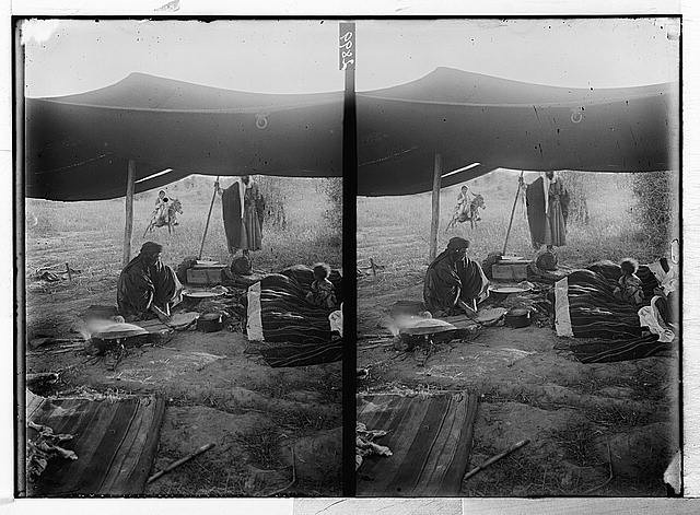 Photo:[Bedouin woman and child in tent]