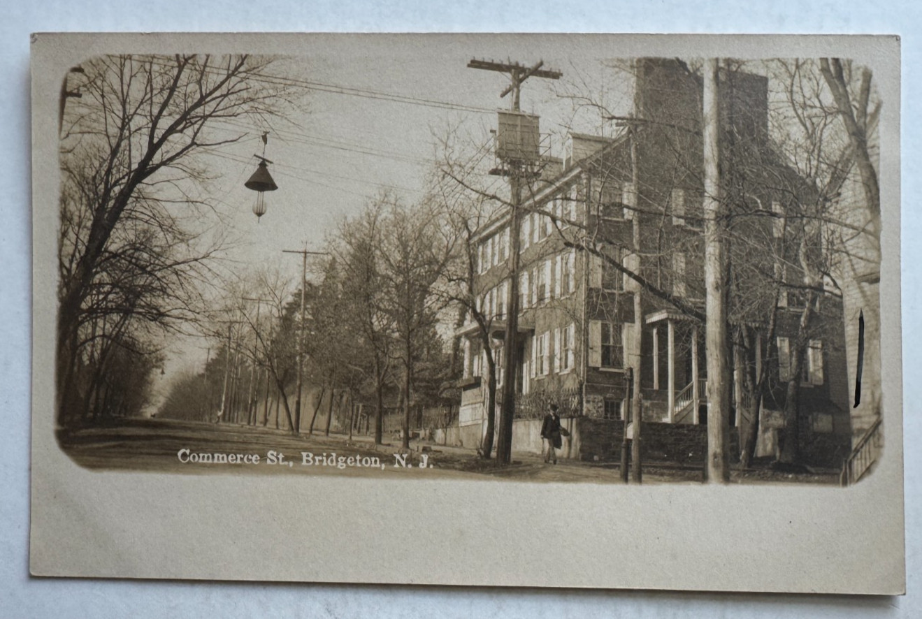 ca 1900s NJ RPPC Postcard Bridgeton New Jersey Commerce Street man walking AZO