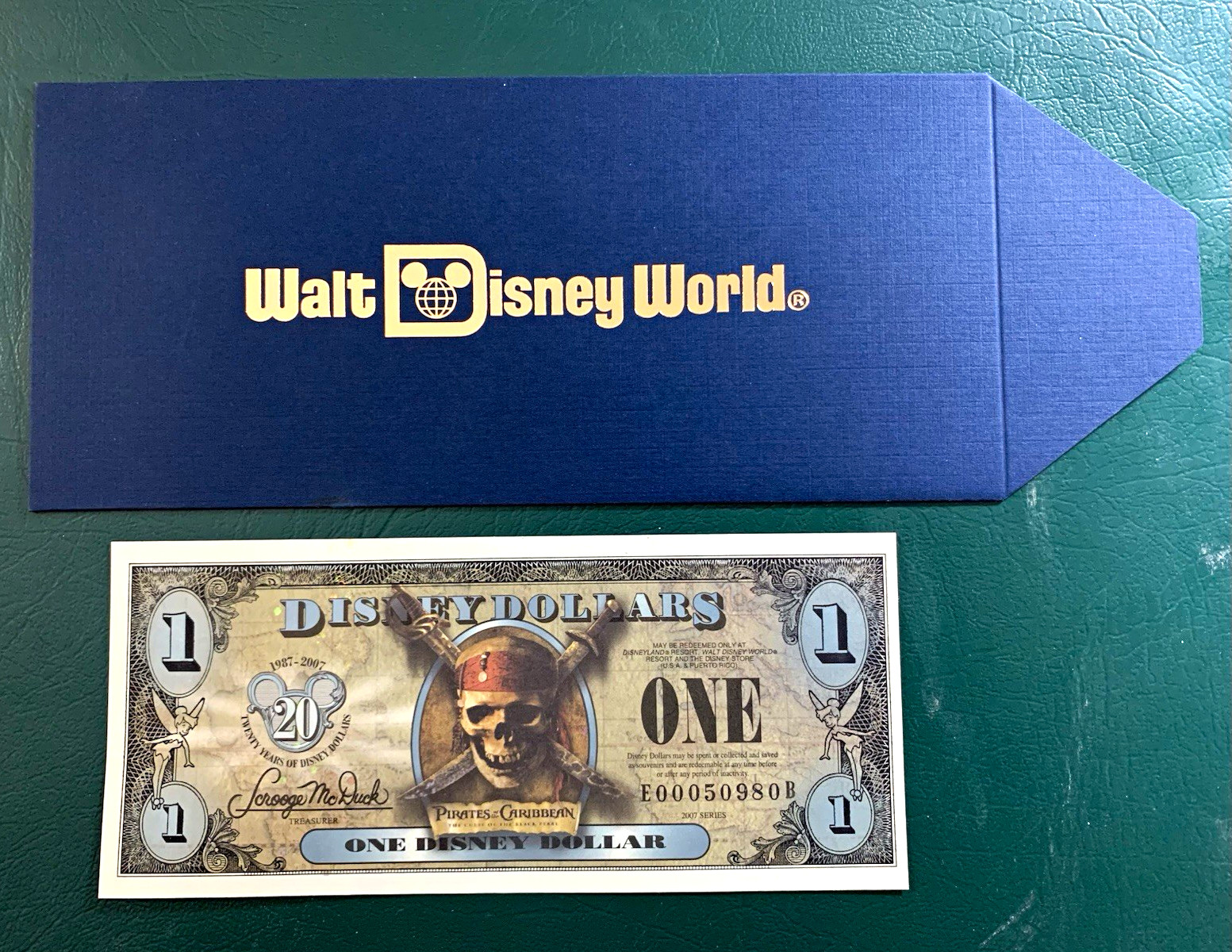Disney dollar envelope ( Ultra Rare version # 34) w/ pirates $1 note Disney dollar envelope ( Ultra Rare version # 34) w/ pirates $1 note