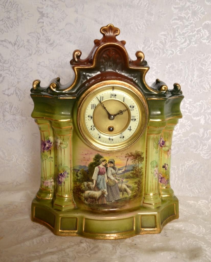 ANTIQUE FRENCH PORCELAIN TIME ONLY MANTEL CLOCK WITH PASTORAL SCENE. SERVICED