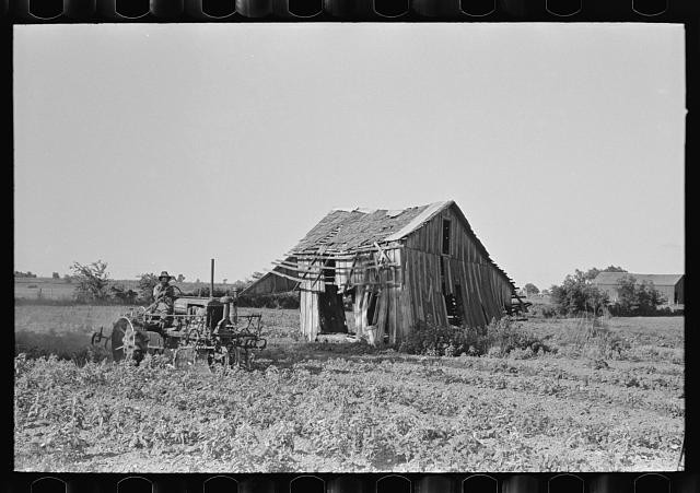 Photo:Wagoner County Oklahoma 1939 Tractor Plowing Abandoned Tenant House
