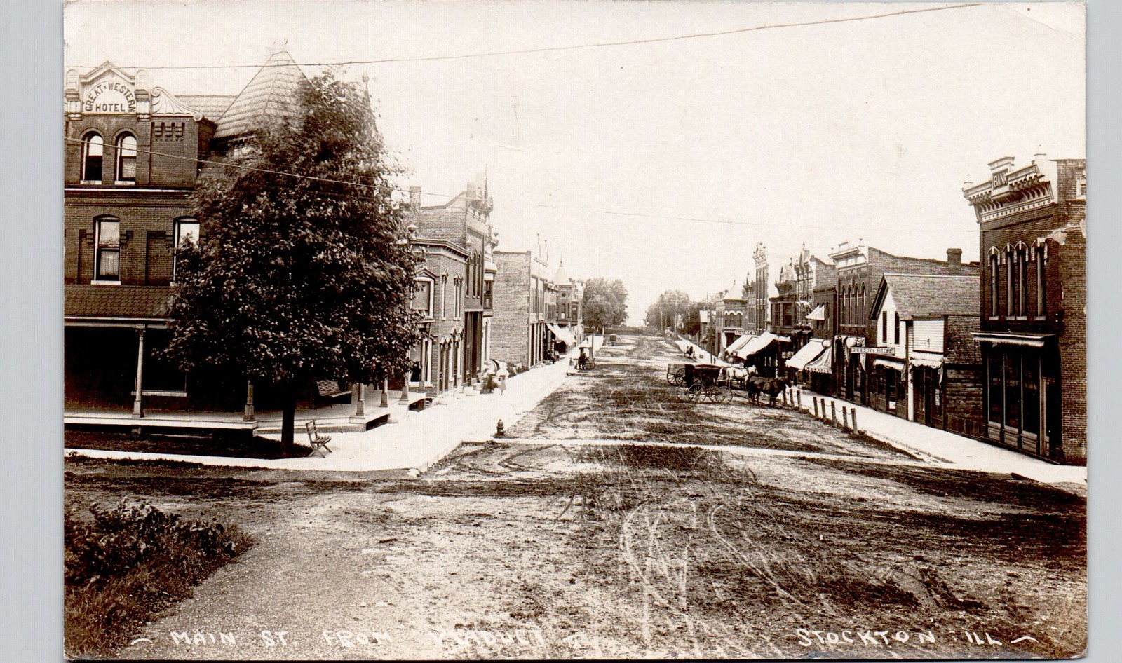 MAIN STREET stockton il c1910 postcard illinois real photo rppc downtown shops