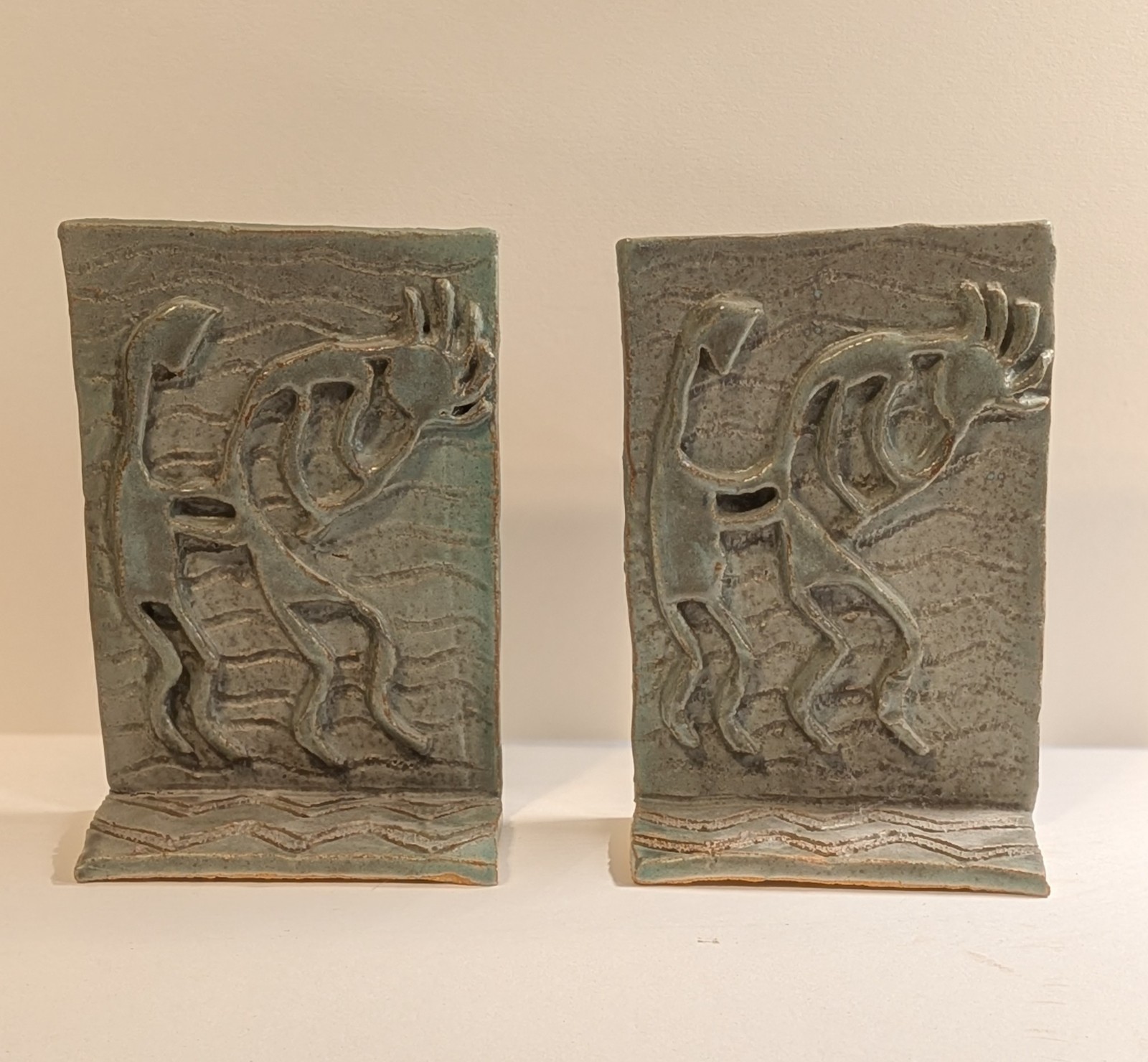 Pair of Handmade Green Ceramic Bookends with Relief Stylized Kokopelli Figures