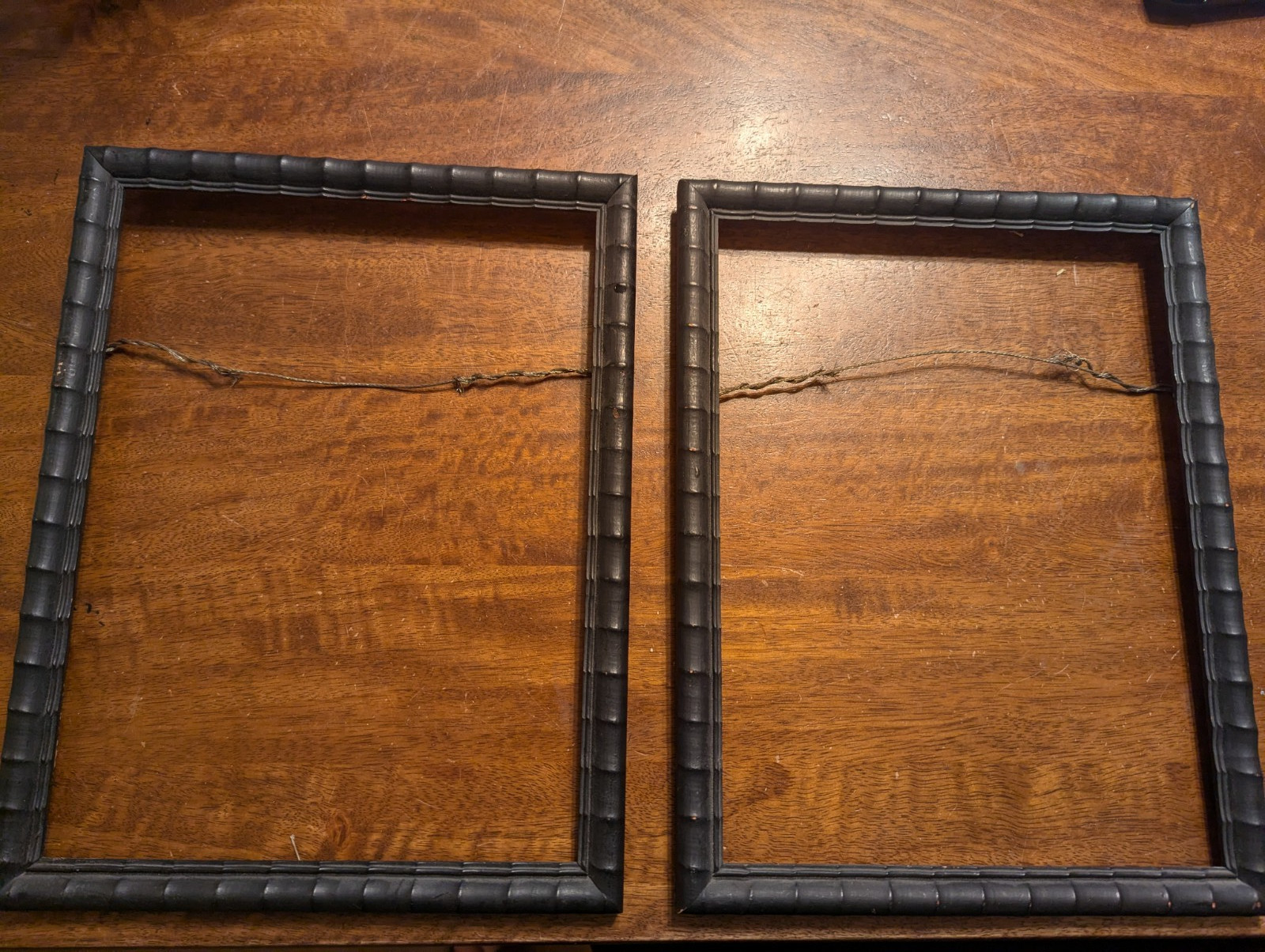 Pair of vintage black wooden bamboo style wall frames 