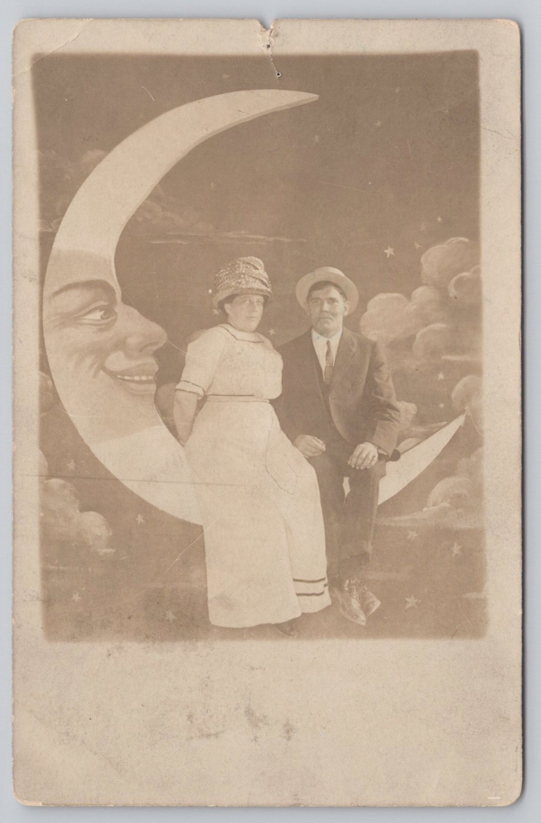 Portrait of Couple Sitting on Anthropomorphic Paper Moon RPPC UNP Postcard Portrait of Couple Sitting on Anthropomorphic Paper Moon RPPC UNP Postcard
