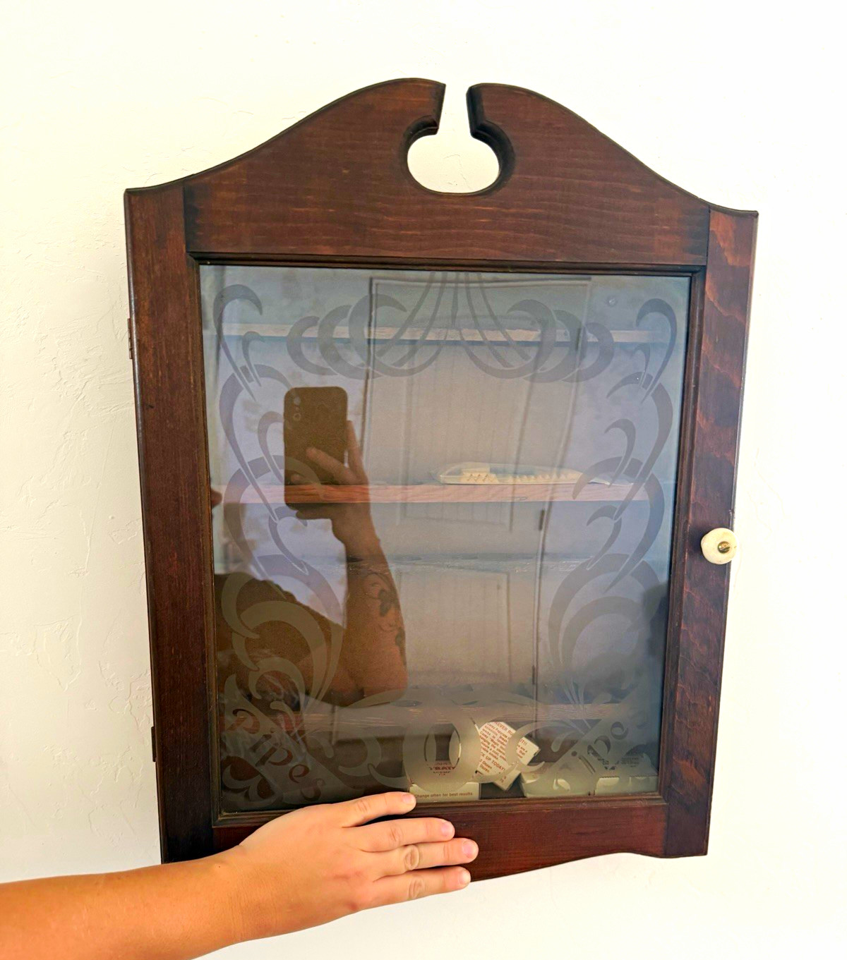 vintage wooden wall-mounted tobacco pipe display cabinet with a frosted or etche