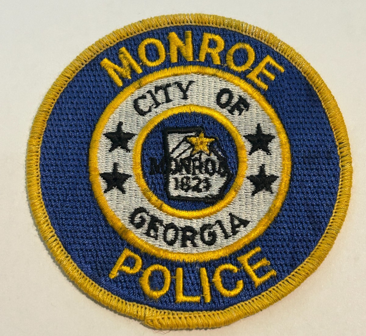 Vintage Monroe Georgia Police Yellow Border Patch Unused