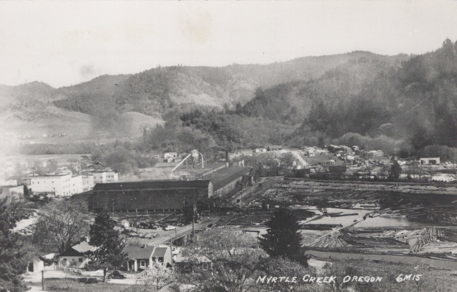 Myrtle Creek Oregon lumber mill log pond view 1940s - RPPC Photo Postcard
