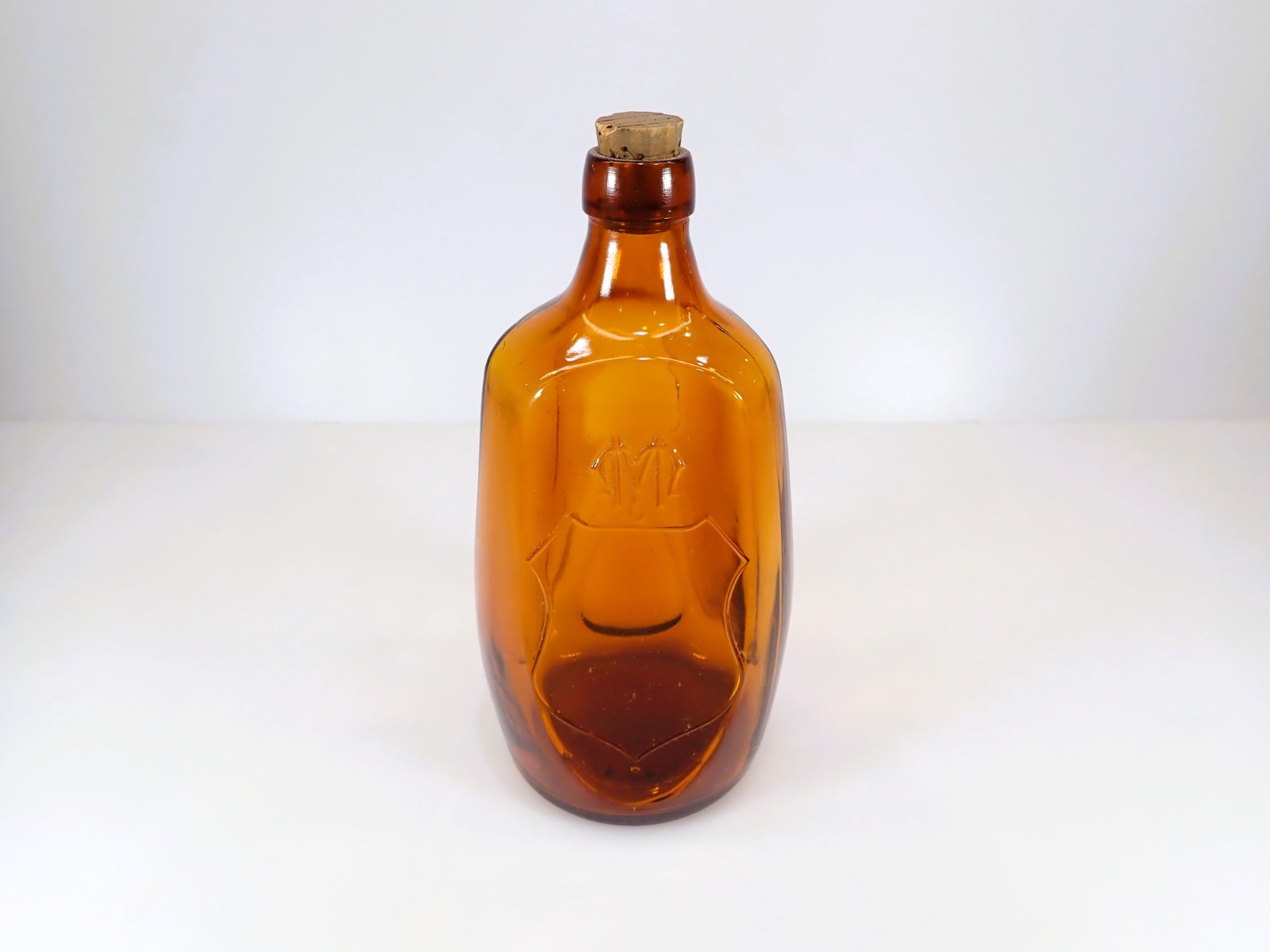 Vintage Amber Glass Triangular Bottle Embossed M Shield Pontil Base Cork Vintage Amber Glass Triangular Bottle Embossed M Shield Pontil Base Cork