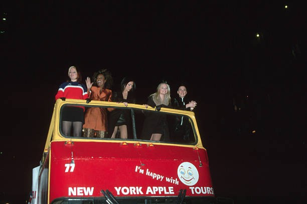 The Spice Girls arriving at Planet Hollywood on a tour bus for a s- Old Photo
