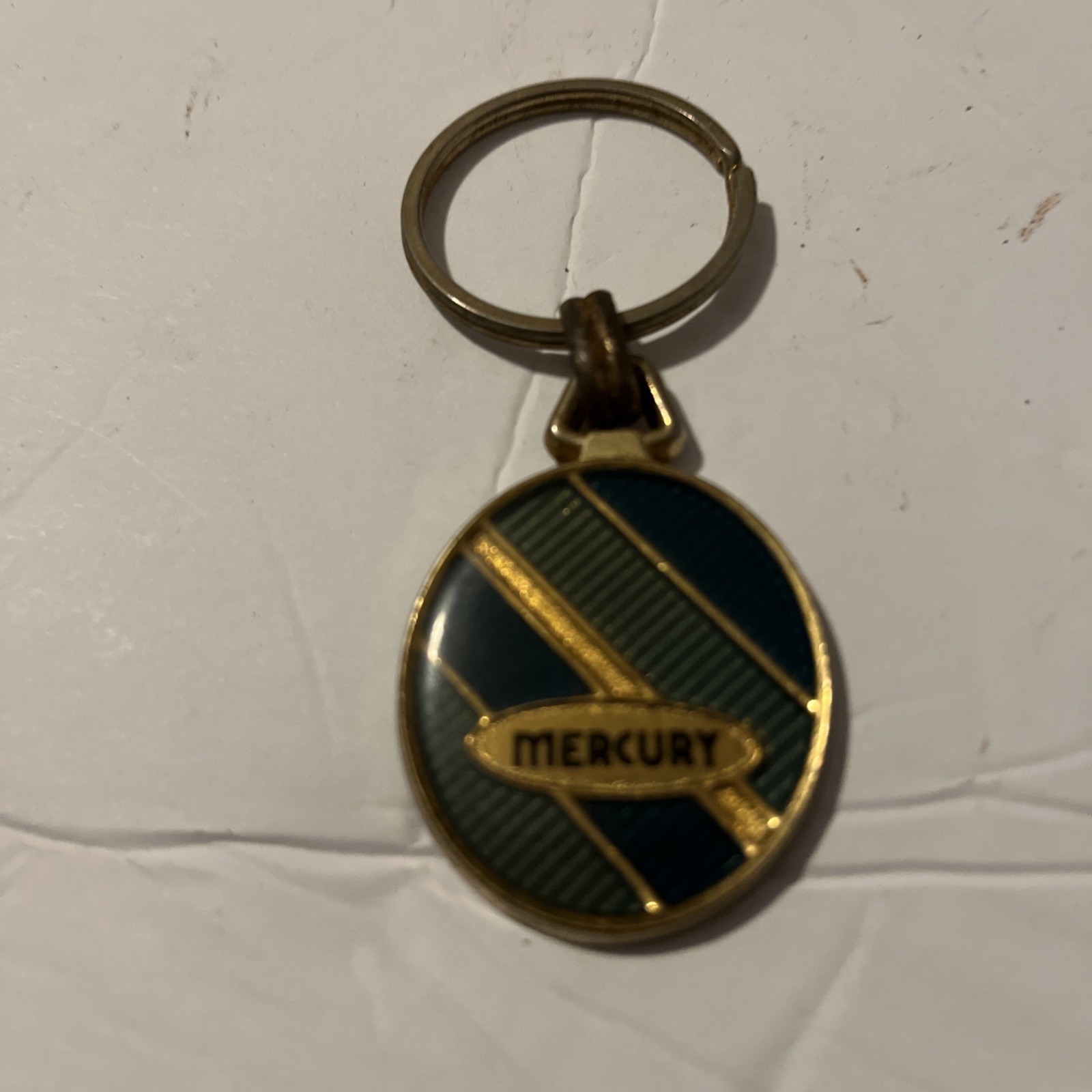 VINTAGE  MERCURY  KEY CHAIN .....
