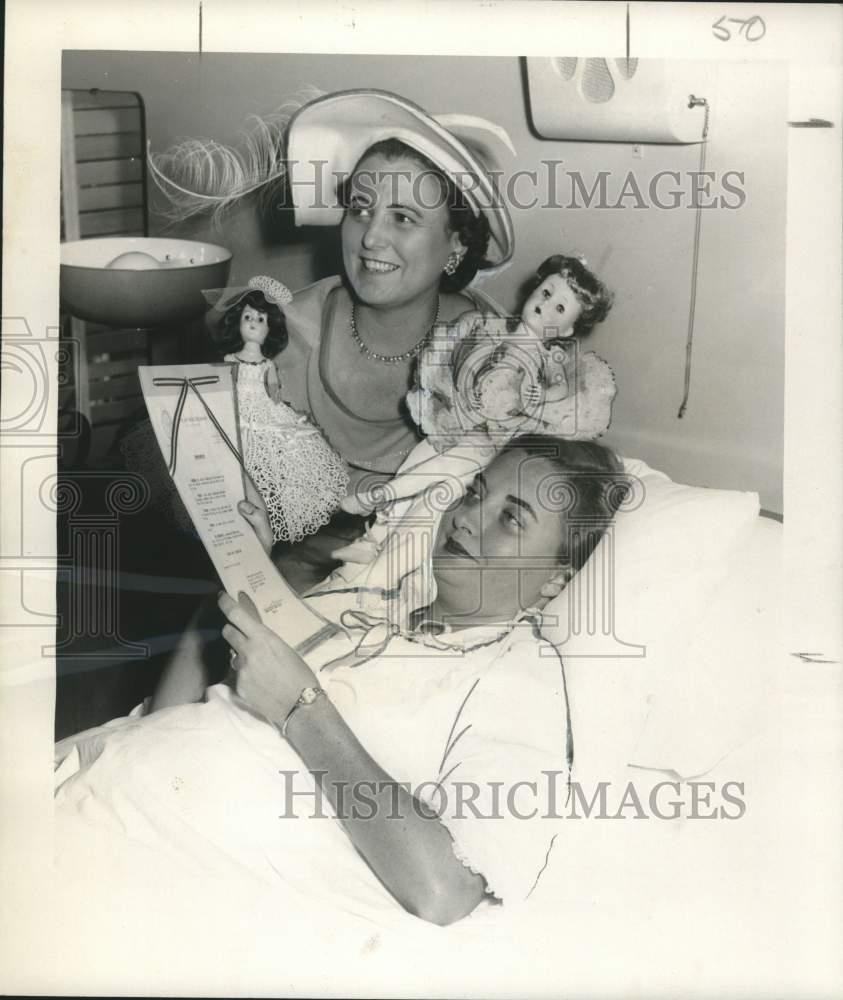 1957 Press Photo Mrs. James LeBreton & Mrs Joseph Cabibi look over proclamation.