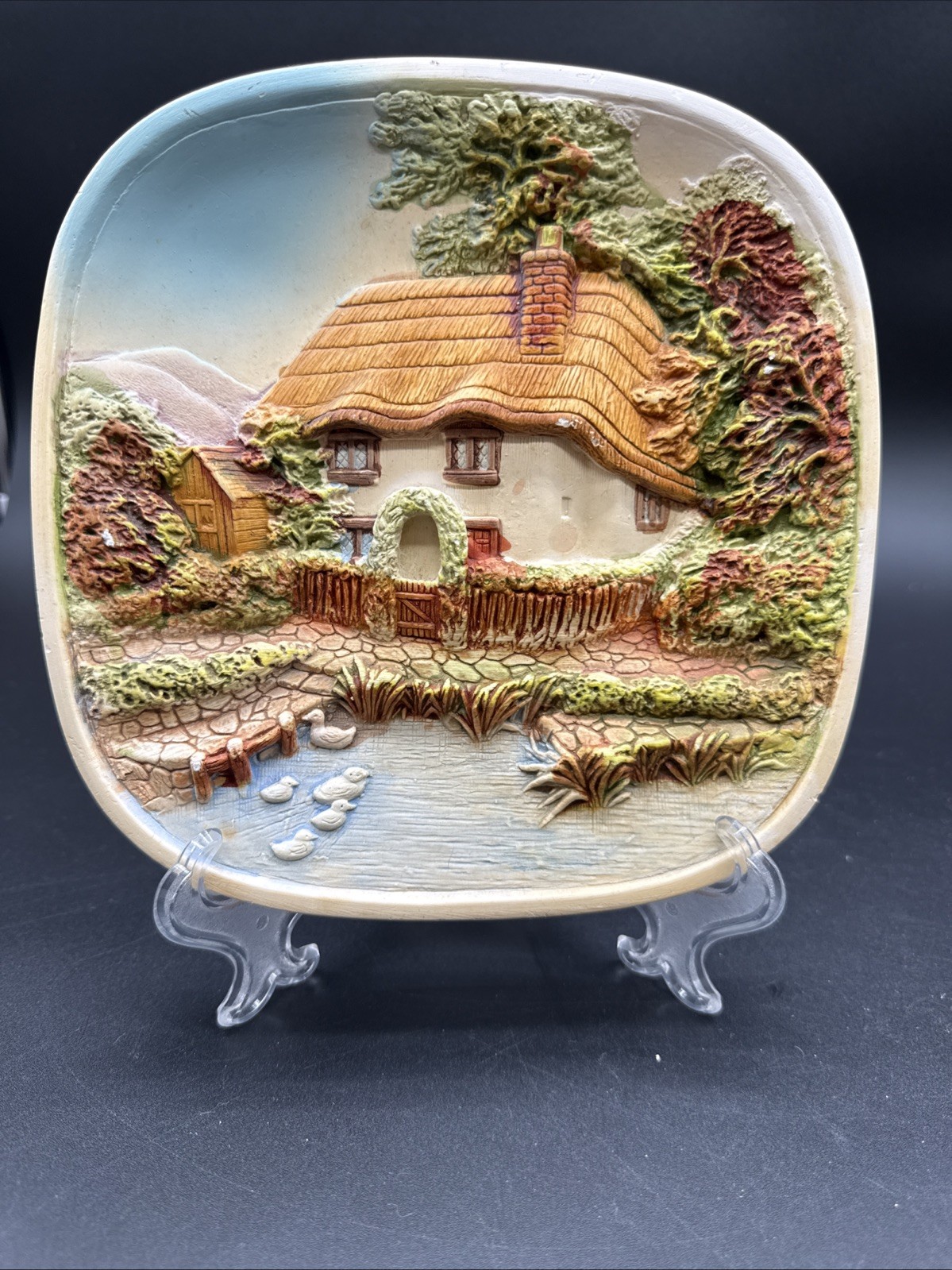 Chalkware relief plaque titled 'English Cottage with Pond' by Legend Products