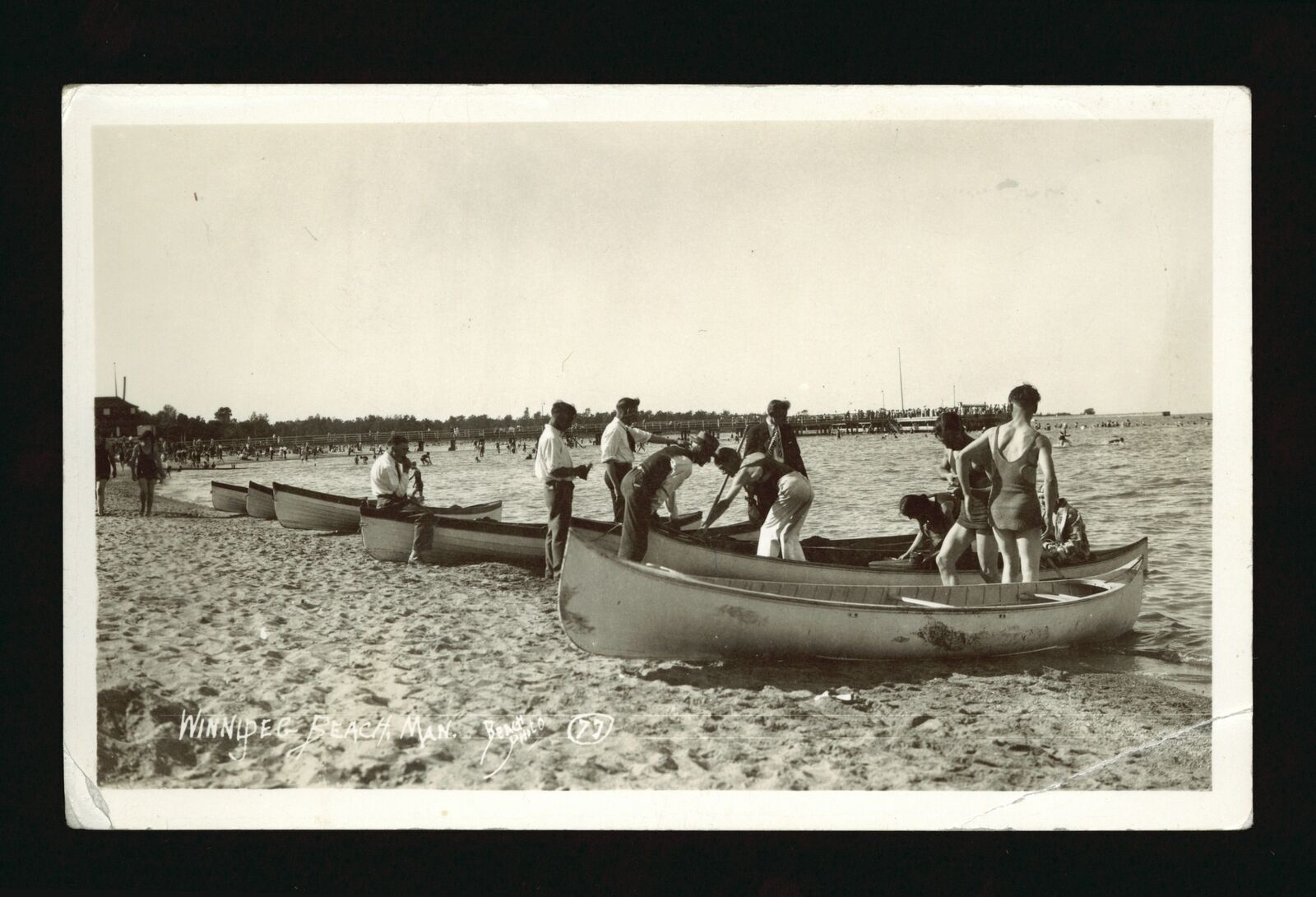Winnipeg Beach Manitoba - People behind canoes pulled up on shore Old Photo