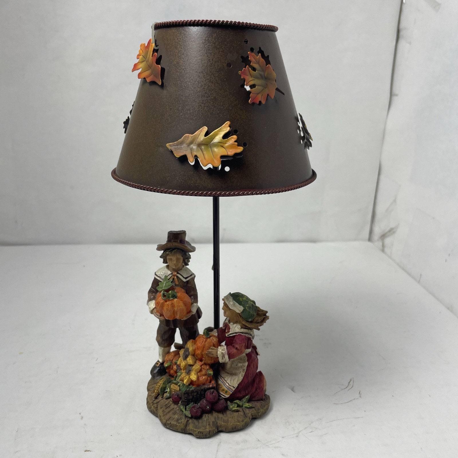 Thanksgiving-Themed Votive Candle Holder Featuring pilgrim Figures & Metal Shade Thanksgiving-Themed Votive Candle Holder Featuring pilgrim Figures & Metal Shade
