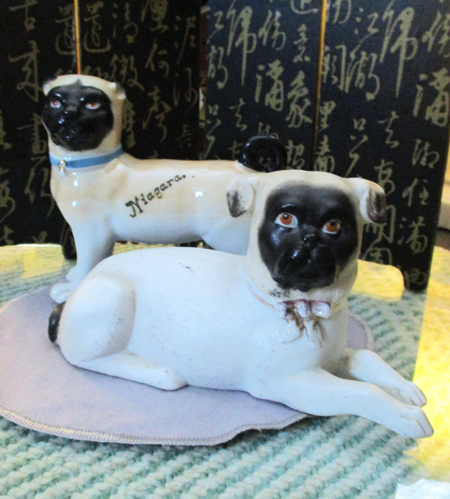 TWO ANTIQUE PORCELAIN *PROBABLY GERMAN* PUG DOGS* 1 - 5 IN. LONG* 1 -7 IN. LONG