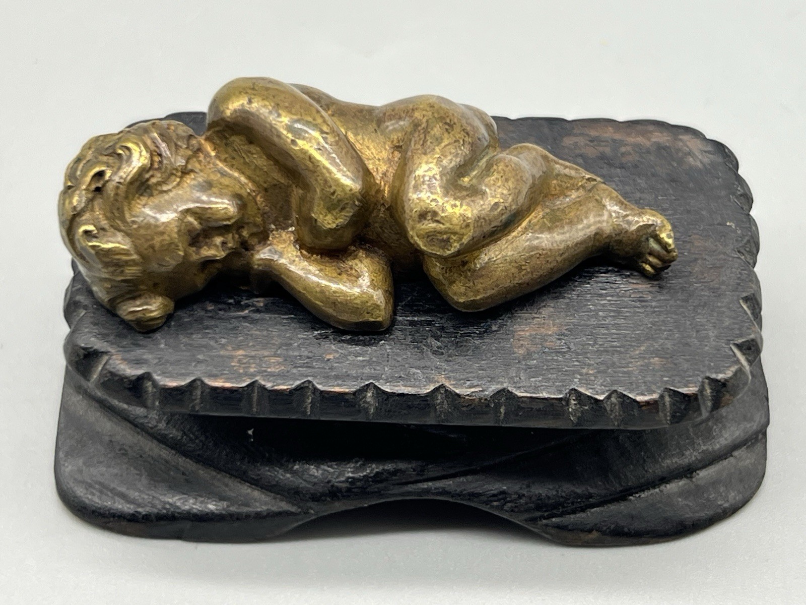Antique Cast Bronze Sleeping Christ Child on a Hand Carved Wood Manger