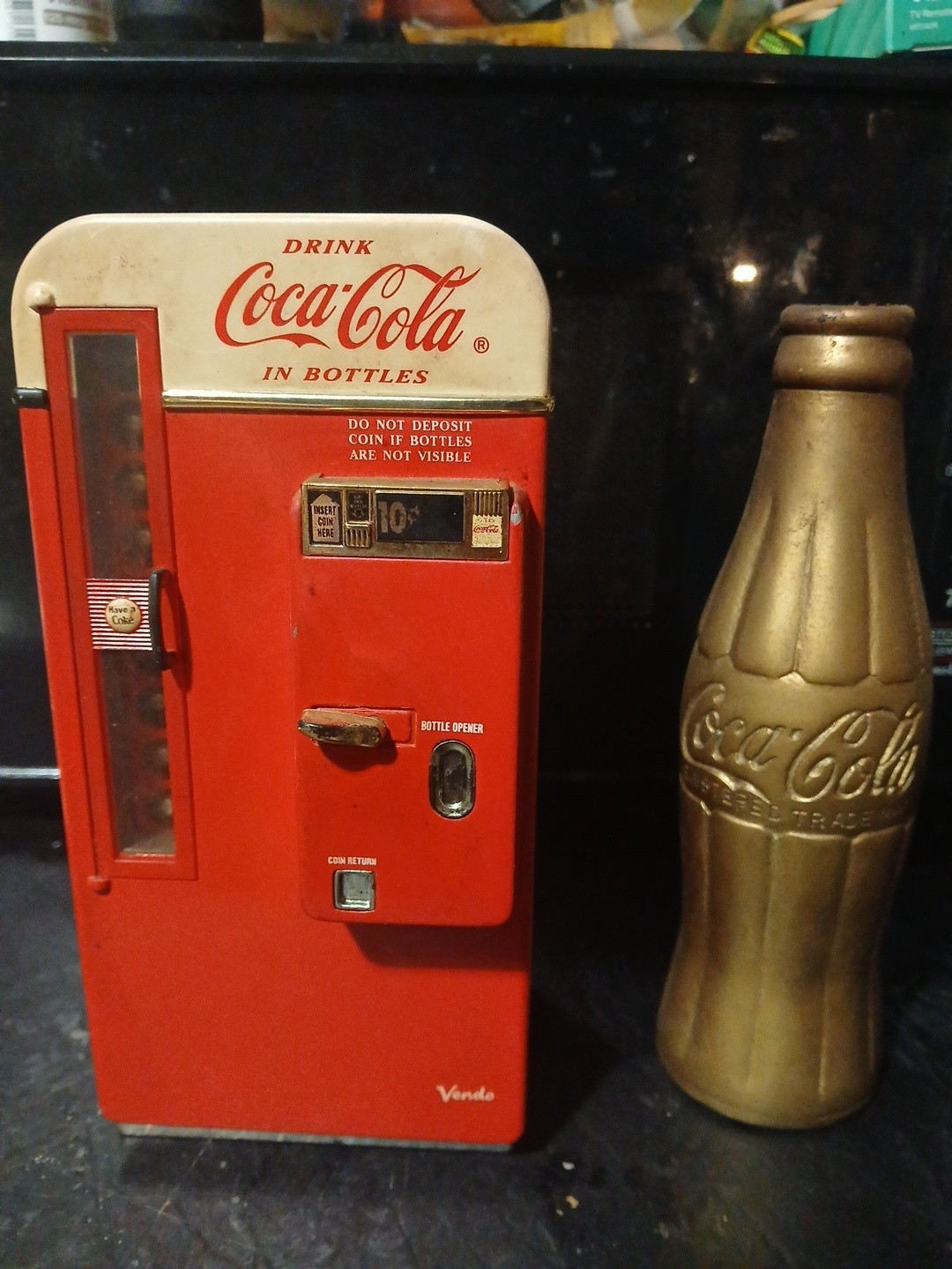 Vintage Coke cola musical piggy bank And Coca Cola Brass bottle