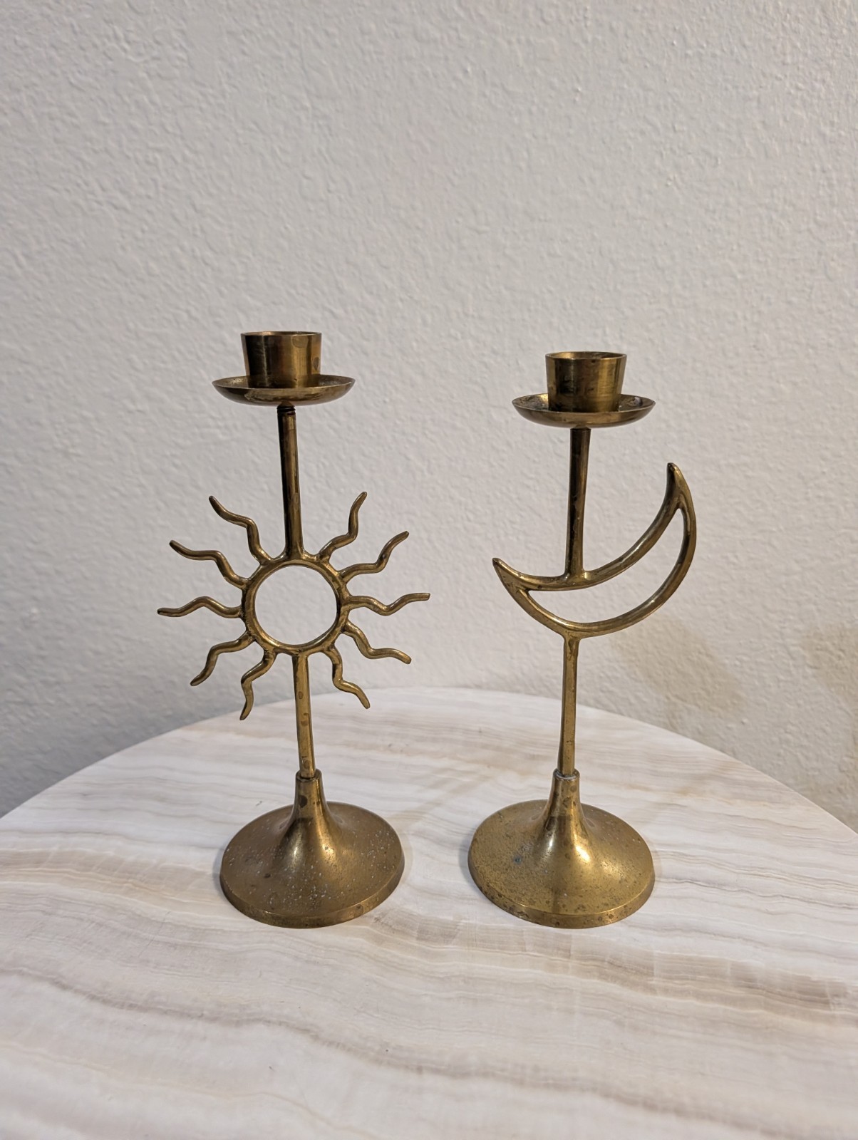 vintage pair of brass taper candlestick holders featuring celestial sun and...