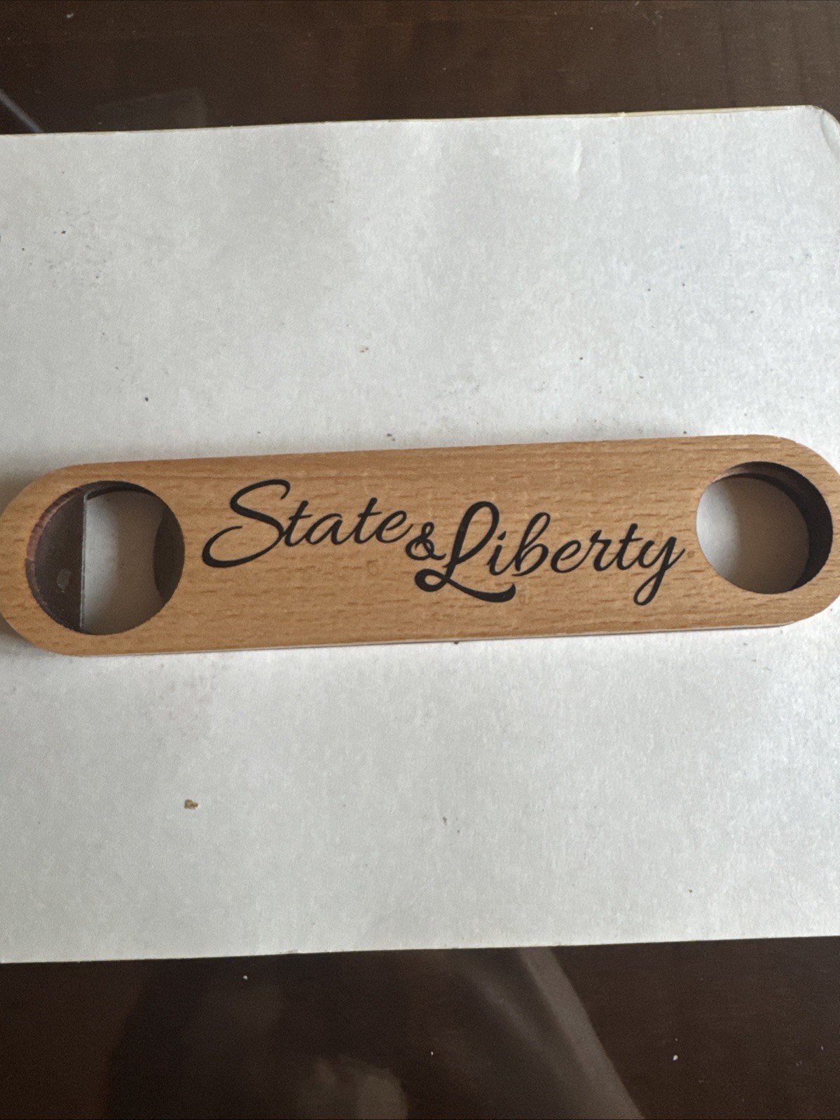 Solid Wood Bottle Opener. State And liberty Clothing Company Branded