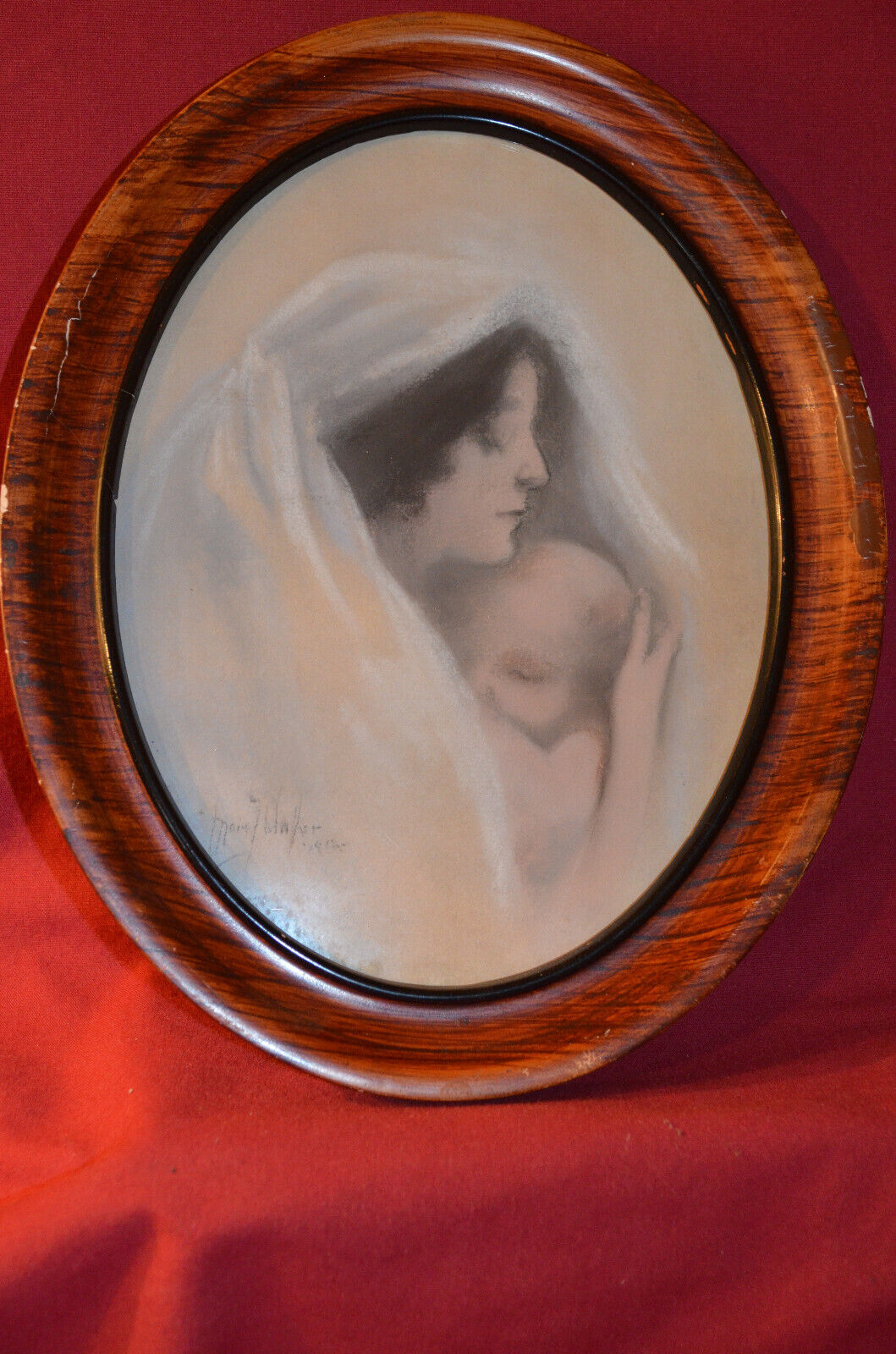 Antique oval wood framed picture of  Mother Mary with baby Jesus. 