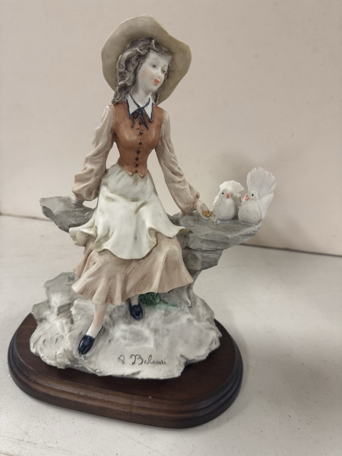Vintage Auro  Belcari Hard Crafted Figurine Depicting A Young Woman W- Doves.