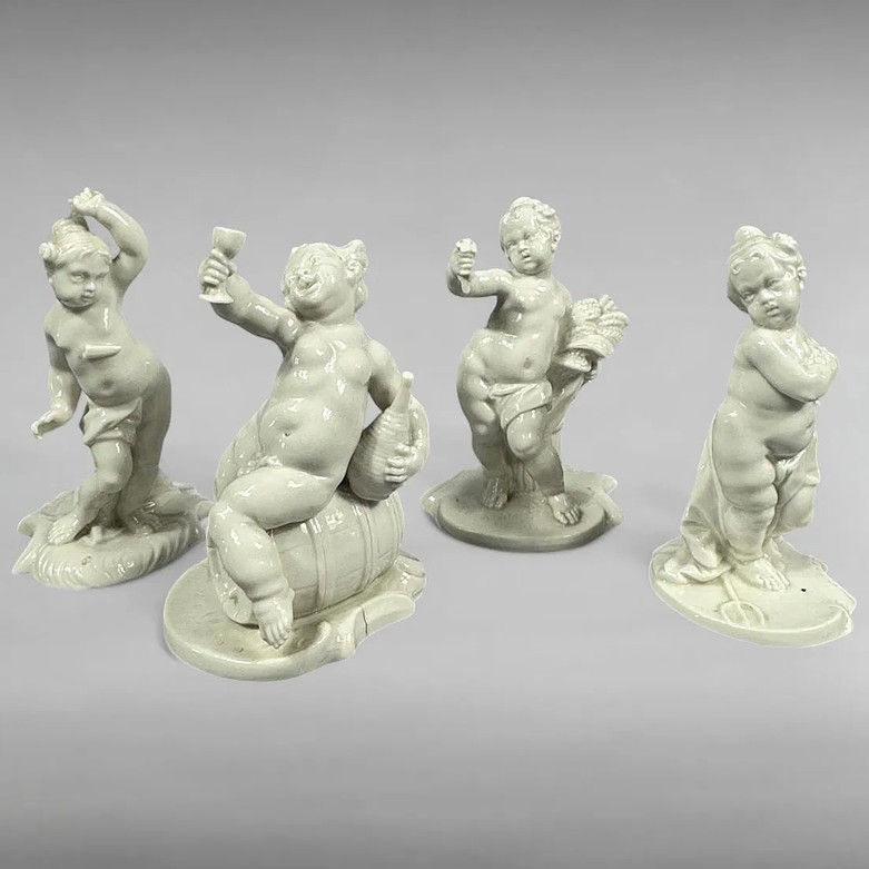 Set of 4 Nymphenburg Porcelain Drunken Cherub Figurines Blanc de Chine Set of 4 Nymphenburg Porcelain Drunken Cherub Figurines Blanc de Chine