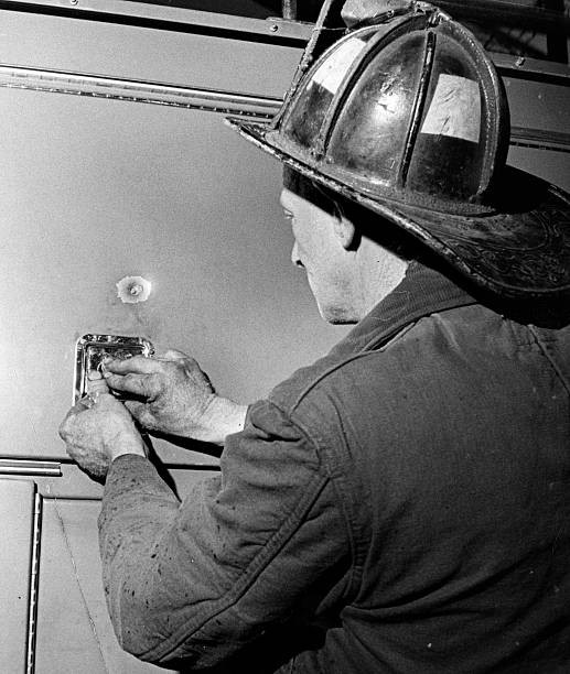 Fireman Edward Upton driver Engine 14 examines sniper bullet - Boston Old Photo
