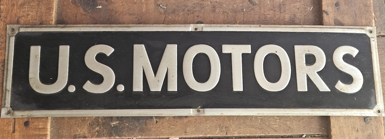 Vintage US Motors Embossed Industrial Metal Advertising Sign