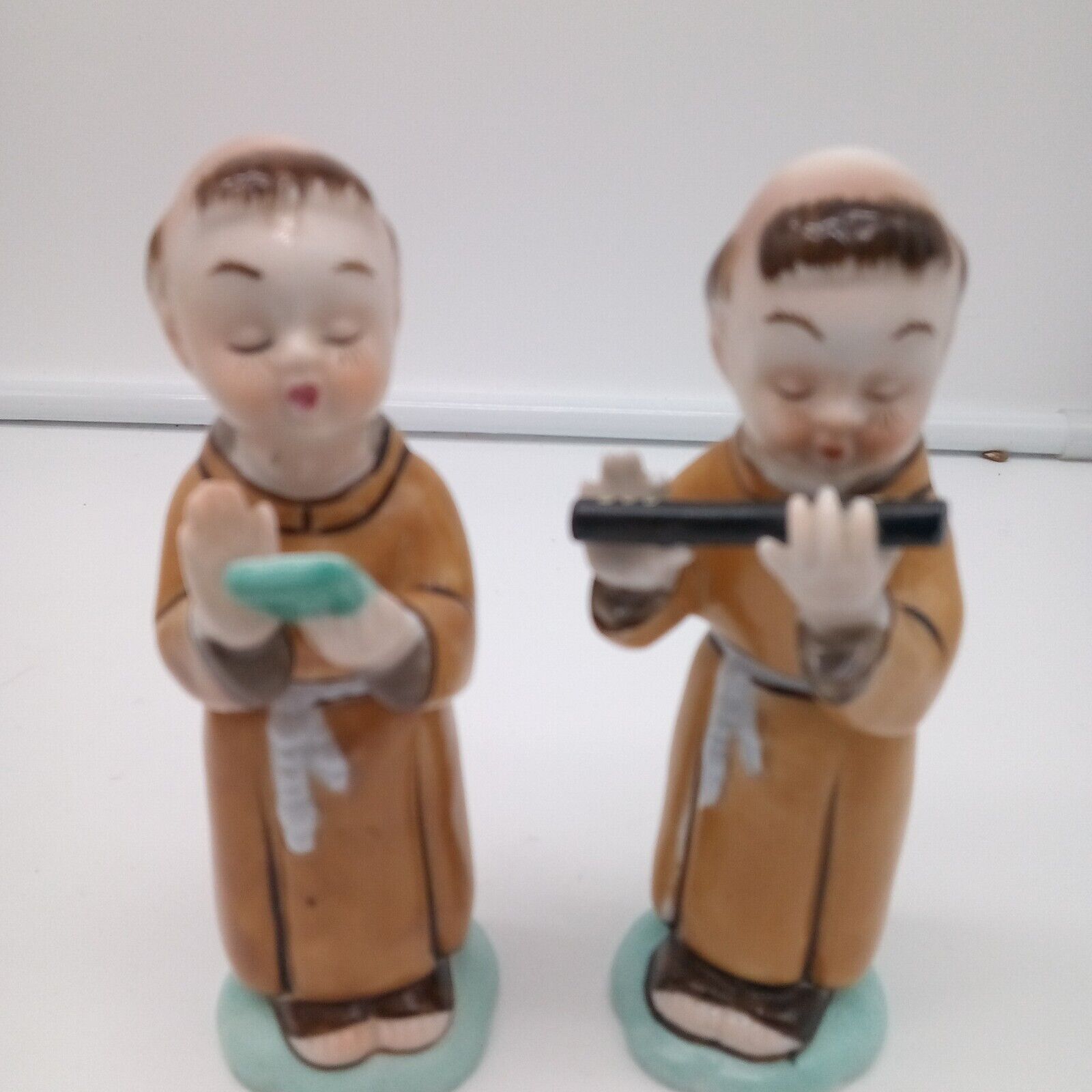 2 VINTAGE MONK PORCELAIN FIGURINES ONE PLAYING FLUTE ONE MUSIC CONDUCTOR