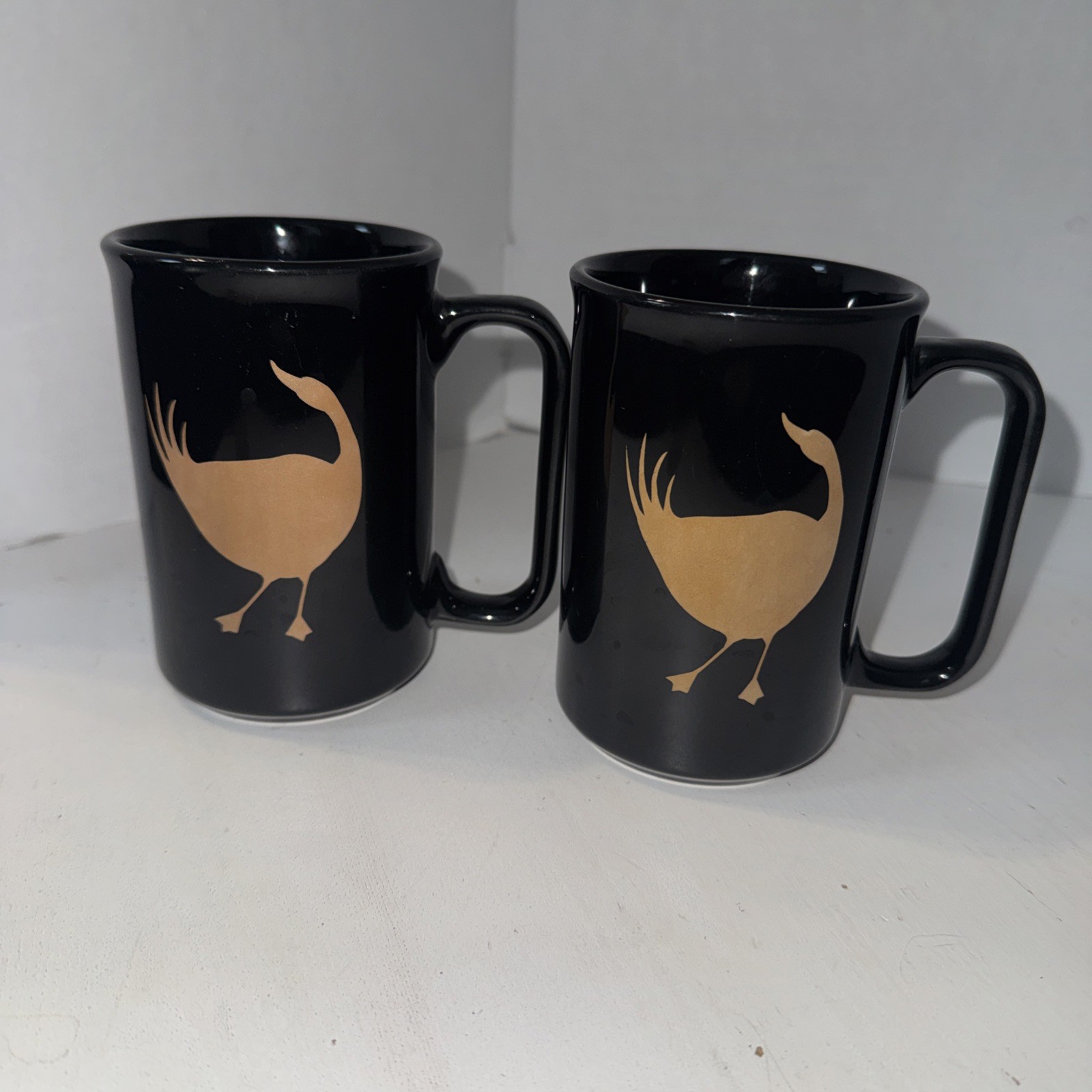 Wild Goose Tavern Pair of 2 Black Ceramic Mugs Tan Gold Goose Silhouette Set