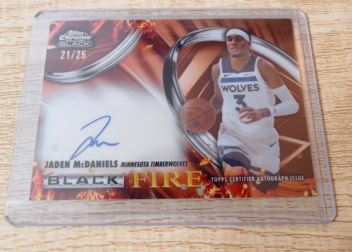 2025-26 Topps Chrome Black Jaden McDaniels Black Fire Auto Orange Refractor /25 2025-26 Topps Chrome Black Jaden McDaniels Black Fire Auto Orange Refractor /25