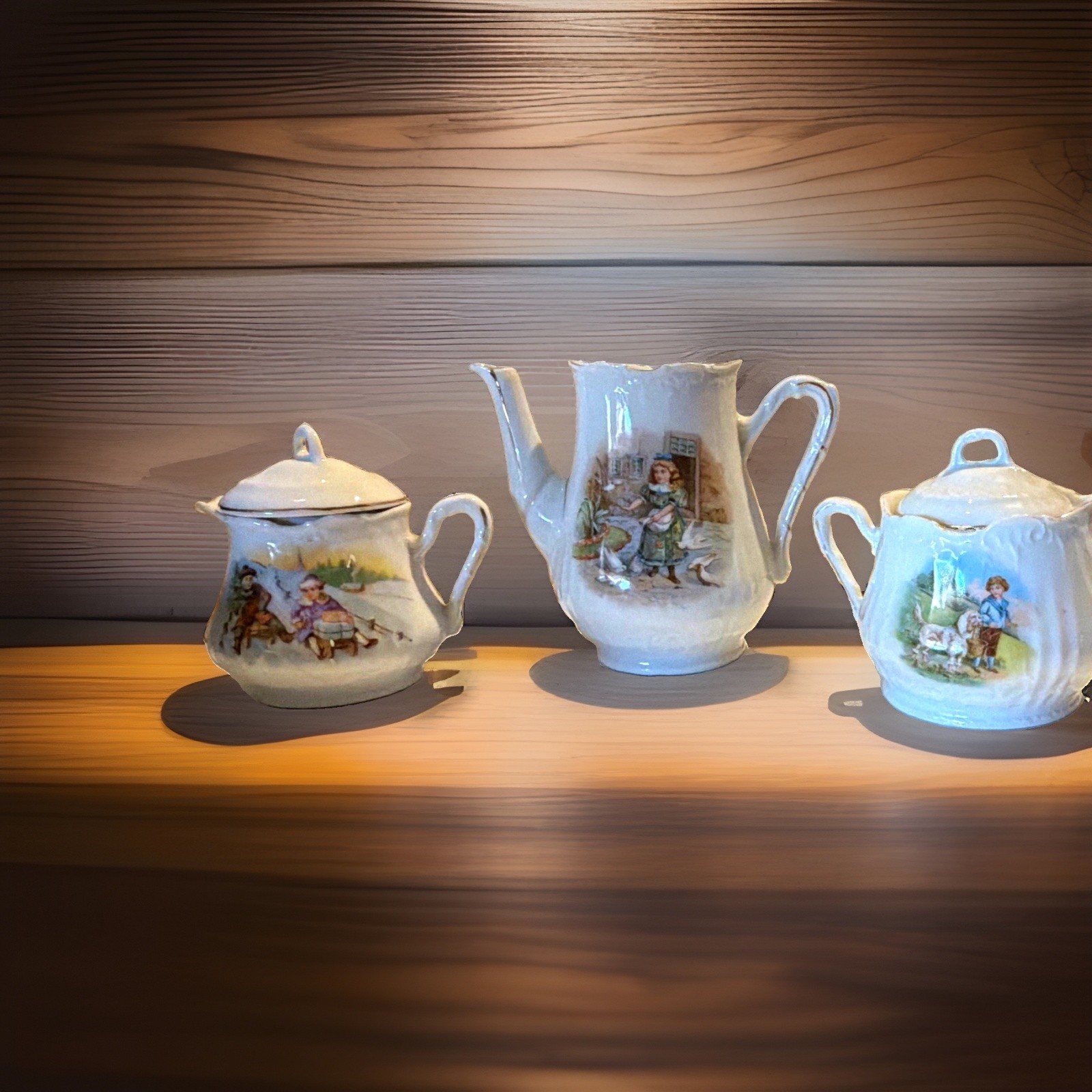  Early 1900s Porcelain Child’s Tea Set – Children Scenes – Silver/Metallic Trim 