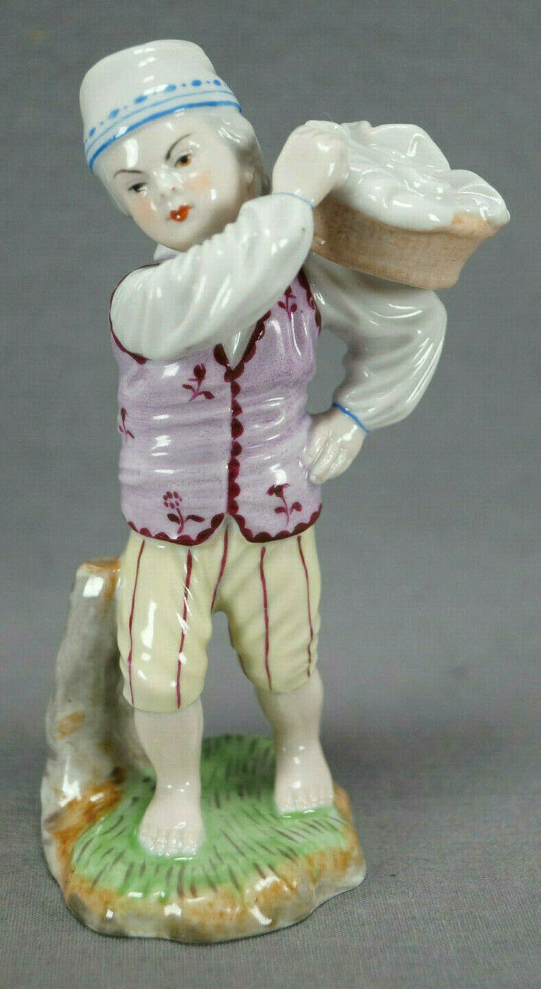 Early 20th Century Hochst Style Hand Painted Boy Carrying Basket Figurine Early 20th Century Hochst Style Hand Painted Boy Carrying Basket Figurine