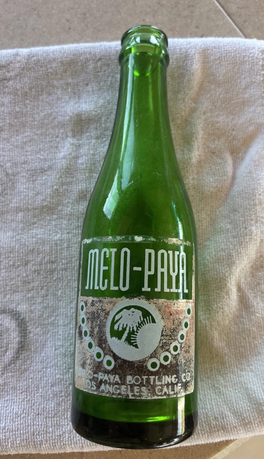 vintage green glass Melo-Paya soda bottle from the 1930s