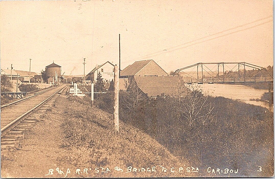 RPPC Caribou Maine Town View & Railroad Bridge Street Scene early 1900s