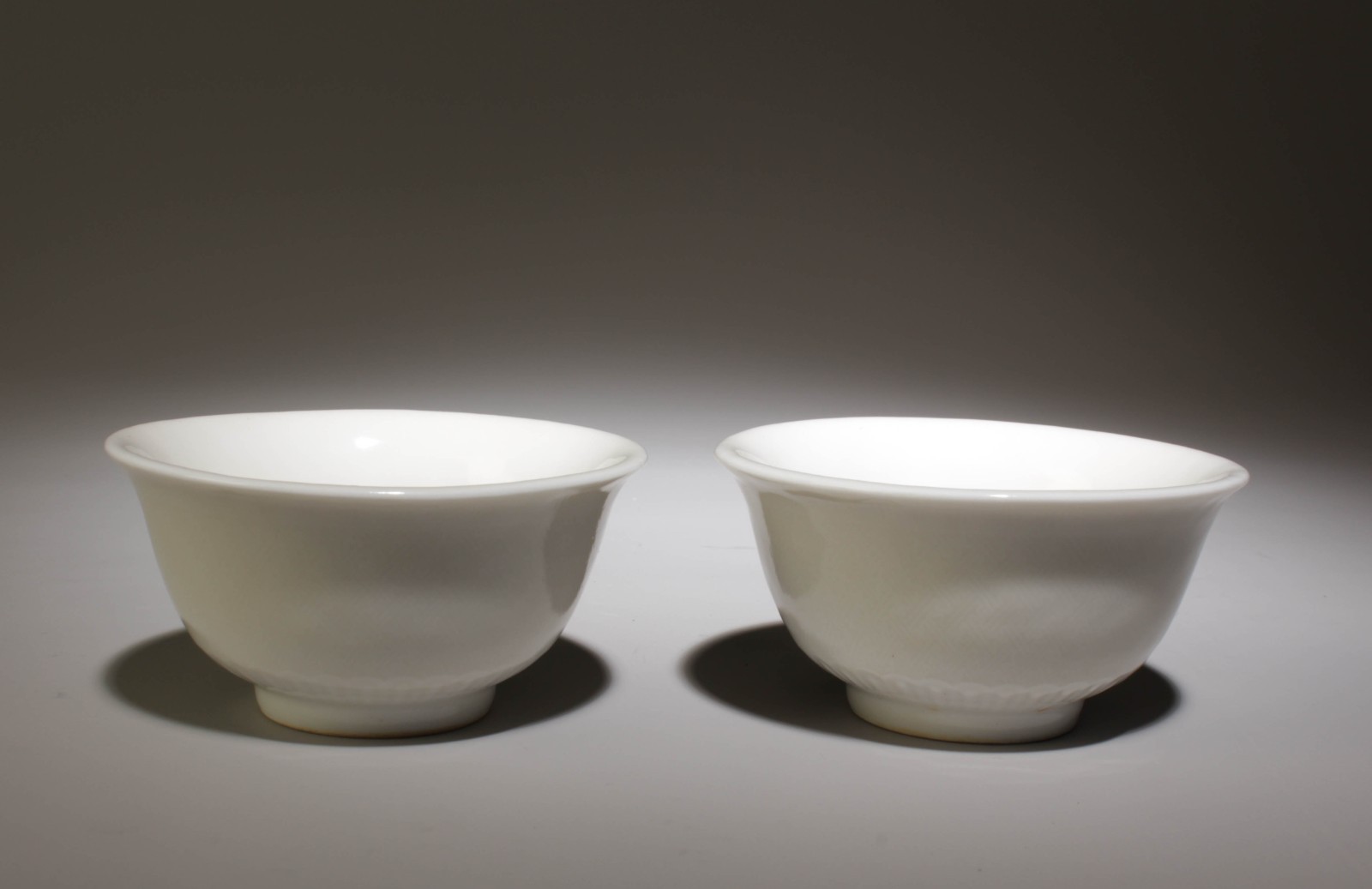A Pair of White Glazed Cups. A Pair of White Glazed Cups.